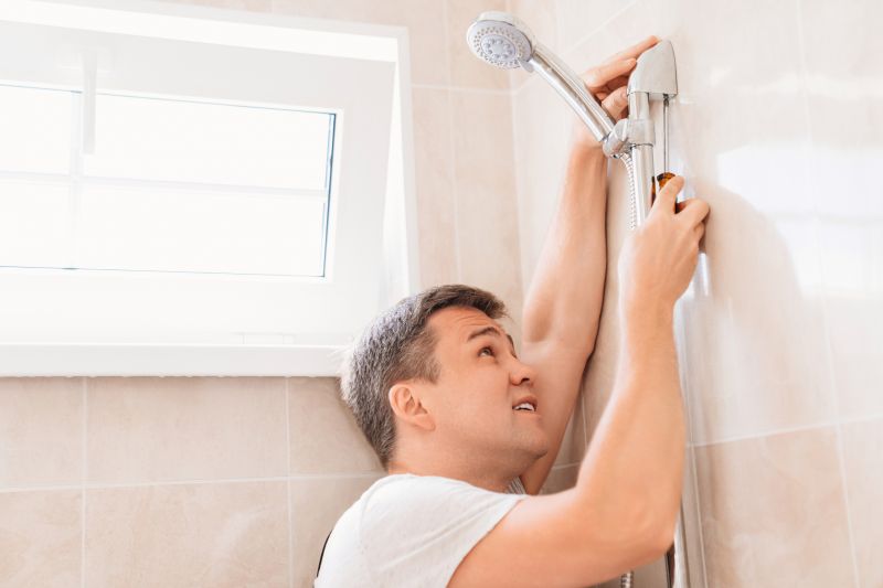 Technician Installing Shower